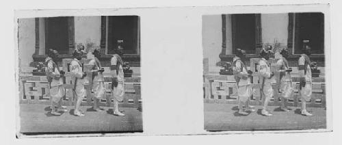 stereo glass slides; men in white uniforms in front of building