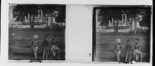 stereo glass slides; three boys sitting on log; house in background