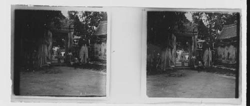 stereo glass slides; person standing in large arch way outdoors