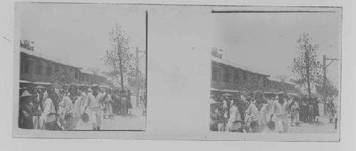 stereo glass slides; young men walking toward camera on street