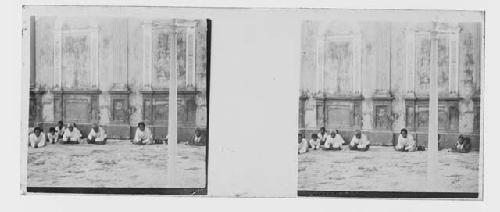 stereo glass slides; men sitting on carpet, door panels in background