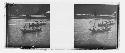 stereo glass slides; people in small boats, shore distance