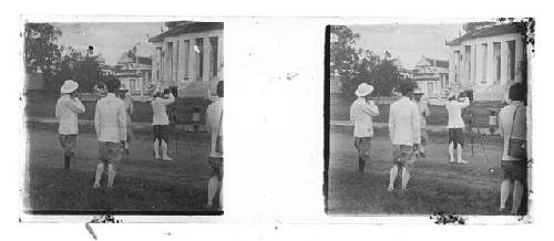 stereo glass slides; men in white jackets watching photographer with camera