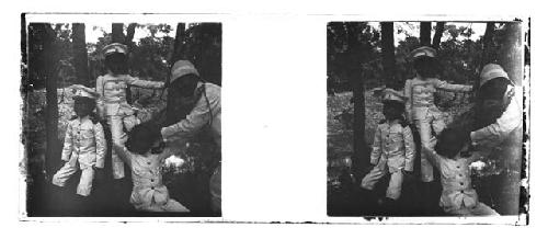 stereo glass slides; men with three boys posed in white military uniforms
