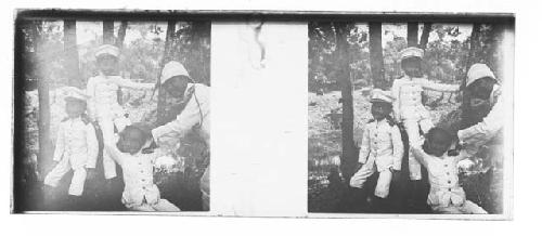 stereo glass slides; three boys posed with man in white military uniforms