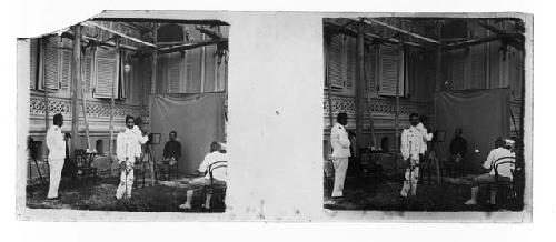 stereo glass slides; man with camera photographing military men in studio