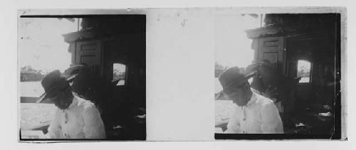 stereo glass slides; two men wearing hats on boat