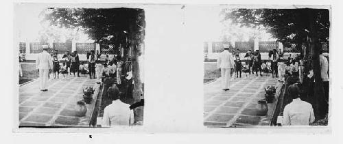 stereo glass slides; military man posing in front of cameras outdoors