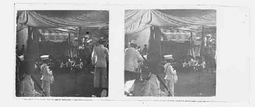 stereo glass slides; boy in white uniform looking at crowd