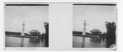 stereo glass slides; lighthouse on river