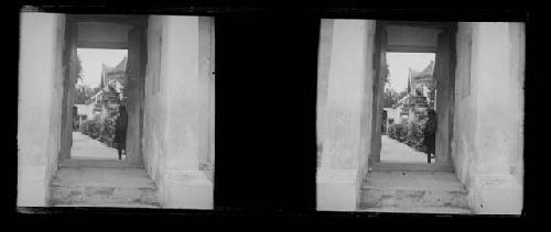 stereo glass slides; person looking in doorway toward camera