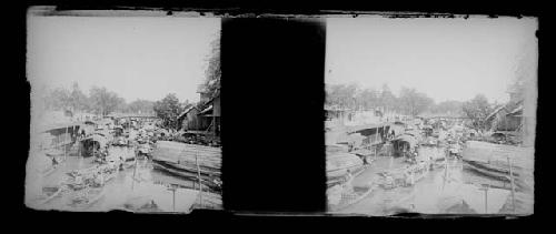 stereo glass slides; obscured view of boats at dock in village