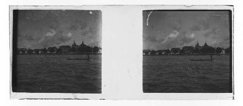 Stereo glass slides of Siam; village from river with boat in foreground