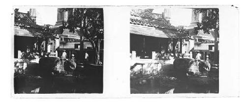 Stereo glass slides of Siam; buildings, pedestrians in village