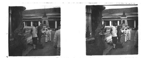 Stereo glass slides of Siam; people outside shrine/temple, statue in foregroun