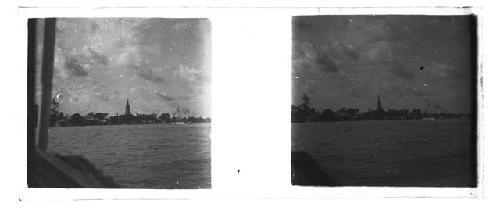 Stereo glass slides of Siam; water view of town, shrine structures in distanc