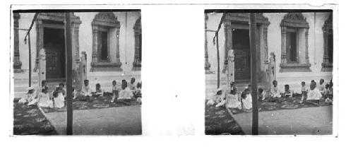 Stereo glass slides of Siam; children seated outside building with teacher?