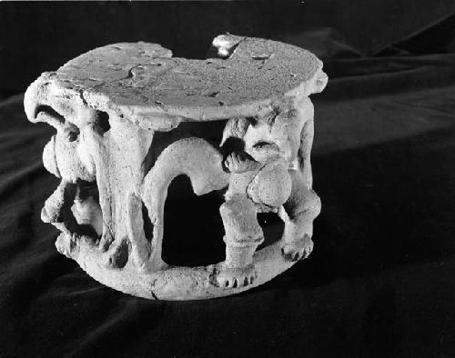 Clay replica of offering table with stylized eagles
