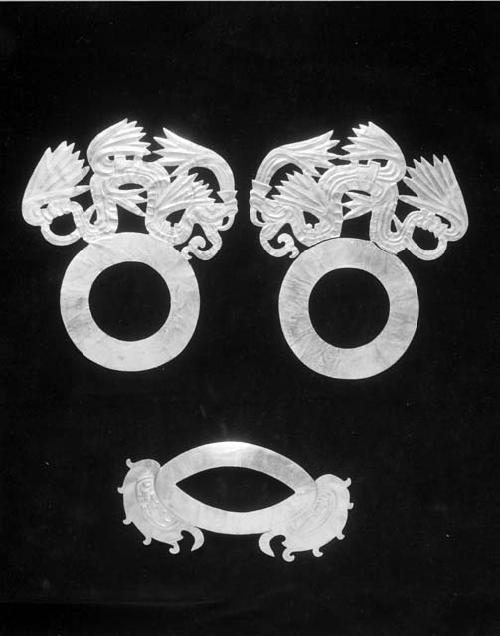 Parts of a gold mask; mouth and eye overlays