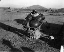 Papago woman with large pots