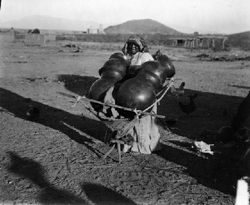 Papago woman with large pots