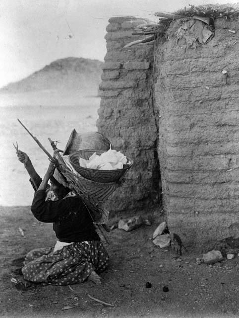 Papago woman with basket on kiho (carrying frame)