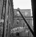 Removal of cast of Stela A from Peabody Museum