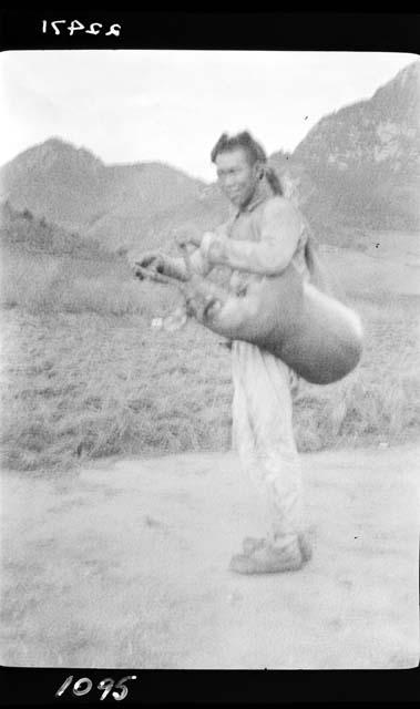 Man carrying bag over shoulder