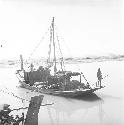 A man stands on a boat on Indus river at Pattan Ferry