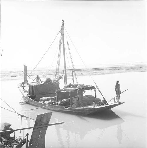 A man stands on a boat on Indus river at Pattan Ferry