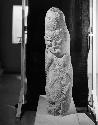 Stone Stela of human figure with animal "Alter-ego" figure on back. Late period III. Carved volcanic stone.