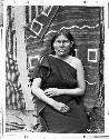 Sallie, a Hopi woman standing in front of a blanket