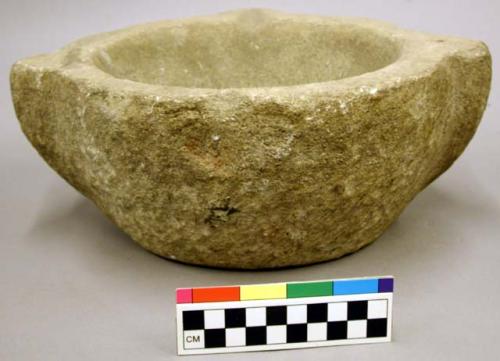 Ground stone, mortar with two handles and one spout