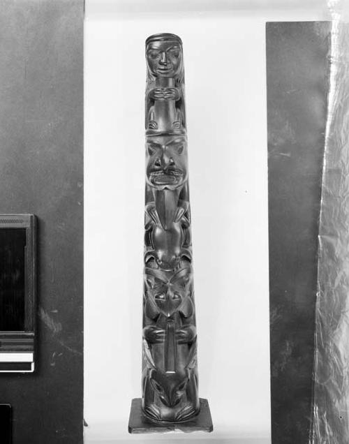 Argillite totem pole; carved animals and ancestors