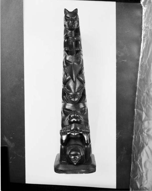 Argillite pole, model of totem (black slate)