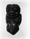 wooden pipe (man's head on one end, bird's head on other end)