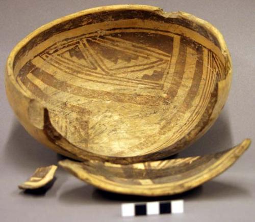 Ceramic bowl and sherds, plain buff exterior, red on buff interior, broken