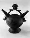 Whistling jar with double spouts and handle. Lambayeque style.