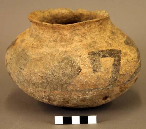 Ceramic jar, brown on orange exterior, flared rim, abraded