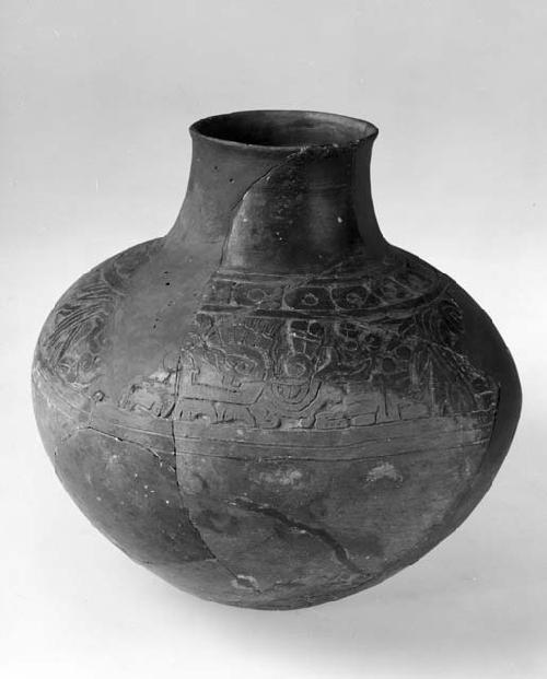 Carved jar with narrow neck