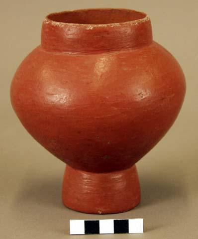 Jar on a foot, red patina