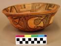 Pottery bowl--diameter 10", flaring rim, light orange with dark brown and red de