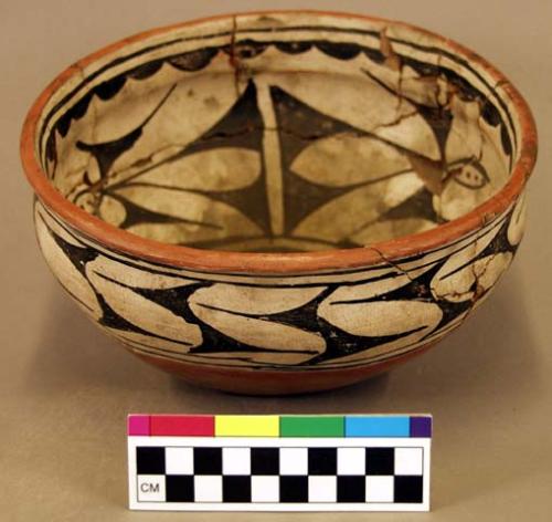 Ceramic bowl, polychrome exterior, steep walls, flat base, mended