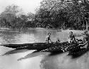 Canoes with carved figure heads