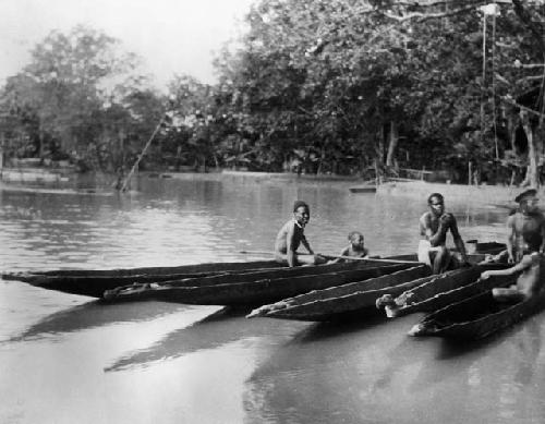 Canoes with carved figure heads