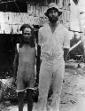 Native and tall white man, village of Derbaub, north coast of New Guinea, near mouth of Sepik River, 1929. (Copy photo of H22749)