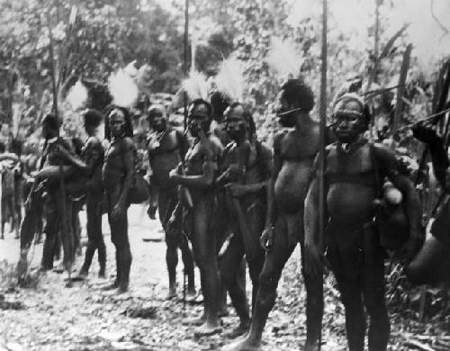 Men with egret plume headdresses