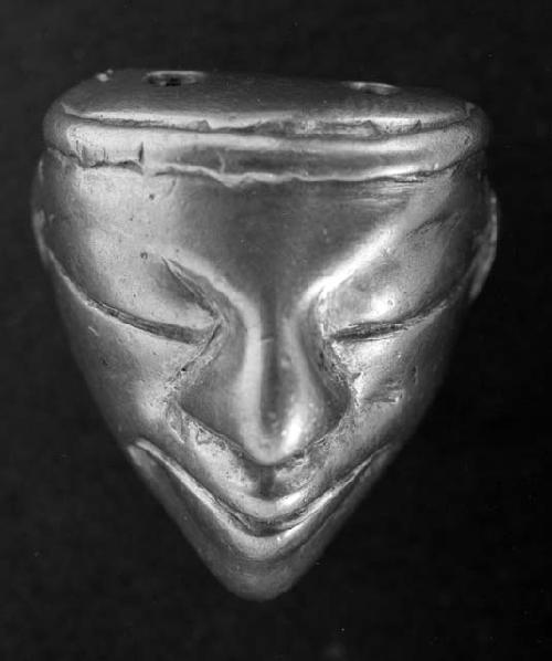 miniature gold human mask