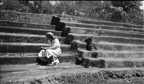 Woman works at excavation site