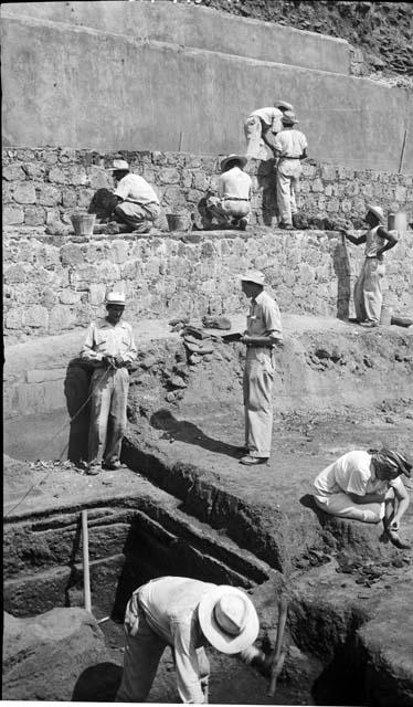 Workers excavate